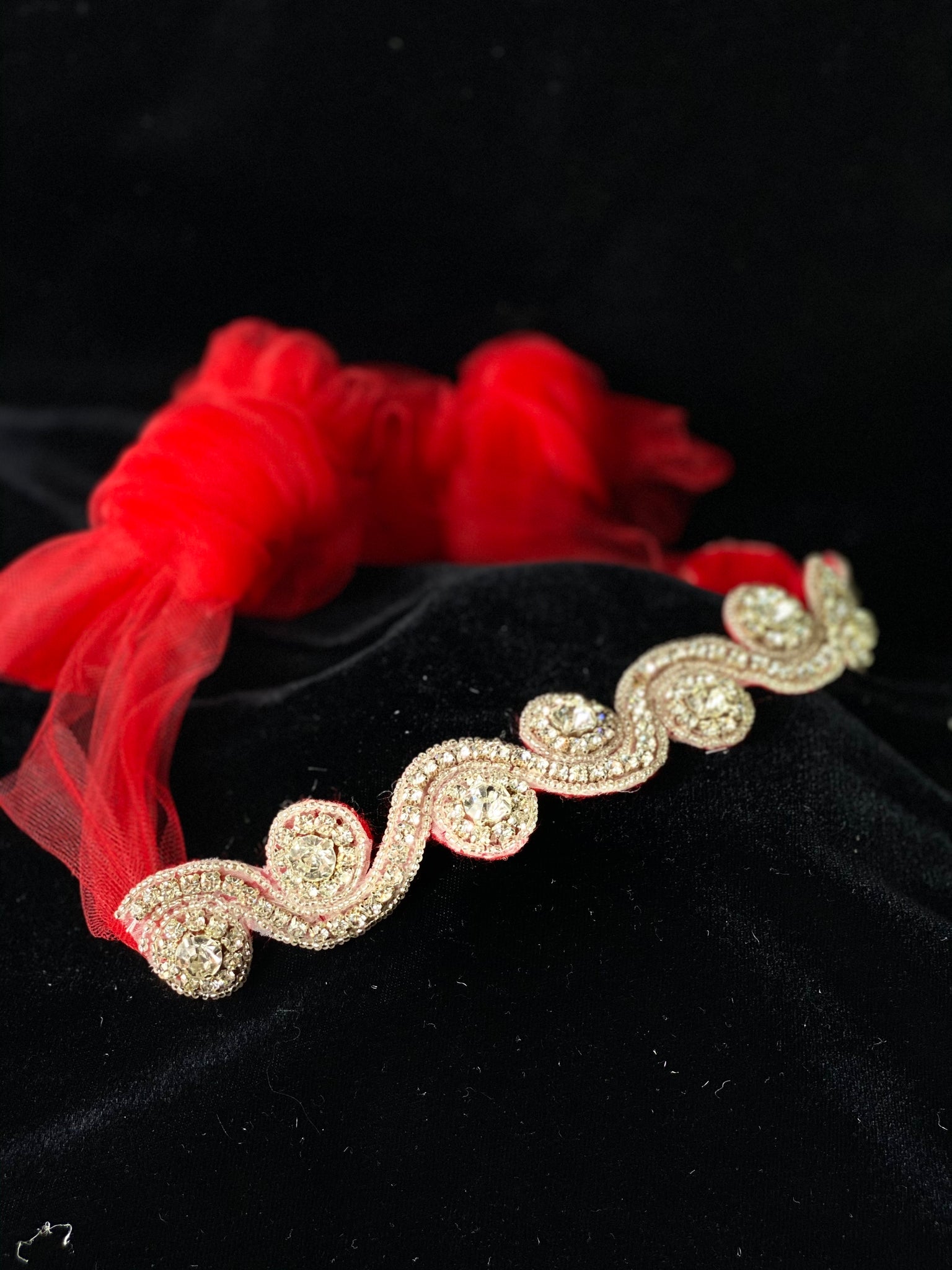 Headband with Strings - Champagne Flower and Tulle Strings  This is an elegant unique handmade and one-of-a-kind headband with a swirl design on red velvet material.  The swirl design is made of beads and rhinestones giving it a gold look and the long red tulle strings are attached.