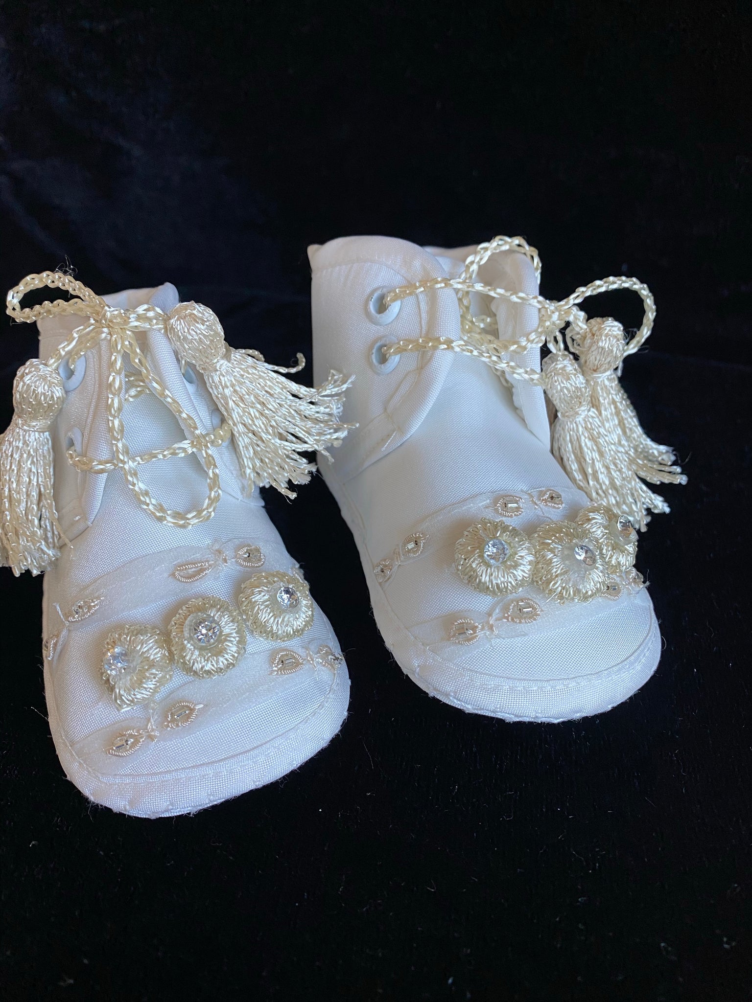 Elegant handmade English style ankle boots in ivory and white with ribbons, embroidery, jewels, and tassel like laces.