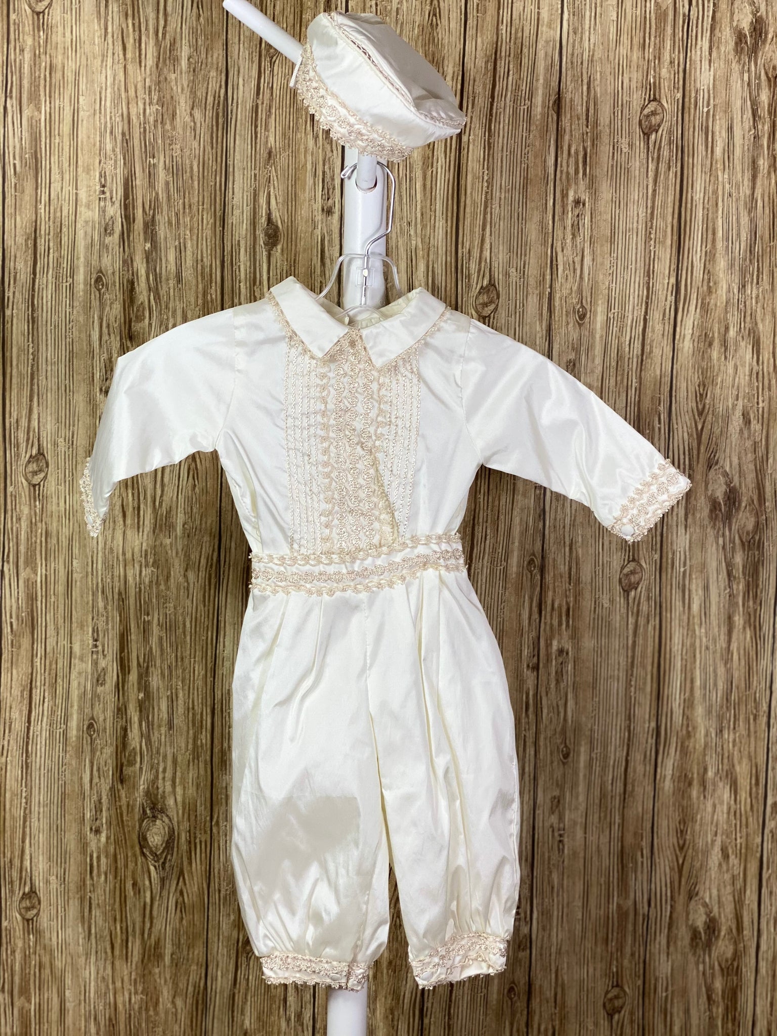 This a beautiful, one-of-a-kind boy’s baptism gown/set.  Lovely clothes for a precious child.  Ivory, size 12M 3-piece set including shirt, pants, beret Layered embroidered trim along cuffs, beret, and cummerbund Intricate braided and embroidered detailing vertical on shirt bodice Thin trim along collar Long sleeves Hand-stitched detailing on beret Button closure on shirt back