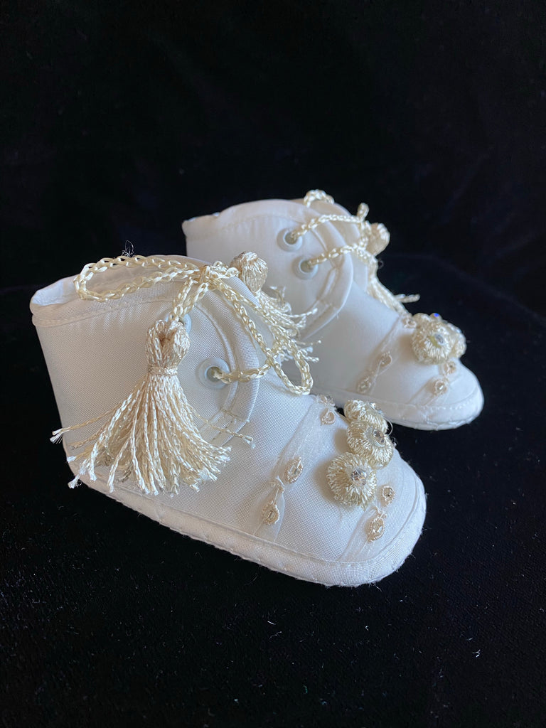 Elegant handmade English style ankle boots in ivory and white with ribbons, embroidery, jewels, and tassel like laces.