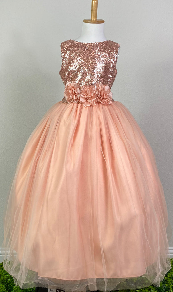 Peach, size 6 Peach sequins bodice Large flowers placed along ribbon going into bow in back Peach satin skirting with tulle overlay Zipper closure Dress pictured with a petticoat Petticoat not included  Choose from a tulle, cloth, or wire for best look