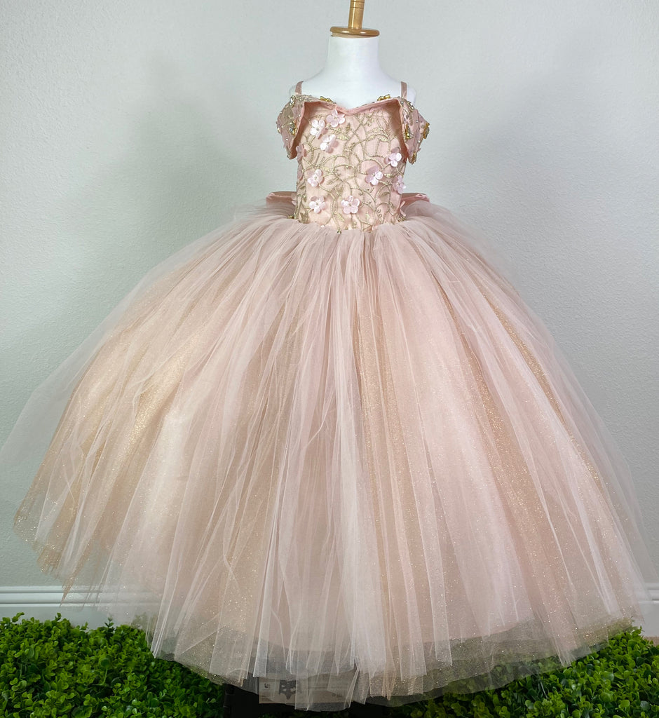 ROSE GOLD Off the shoulder with sweetheart neckline rose gold bodice Gold embroidery with pink flowers and rhinestones along tulle covering bodice and sleeves Large rhinestone band around lower bodice Rose gold skirting with rose gold tulle and glittered gold tulle overlay Corset backing Large rose gold bow on back Dress pictured with a petticoat Petticoat not included Choose from a tulle, cloth, or wire for best look
