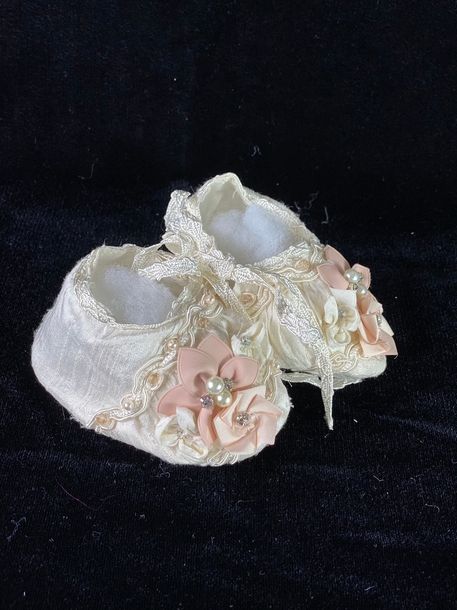 Elegant handmade ivory baby girl shoes with embroidery, lace, flowers, and jewels (pearls and crystals).