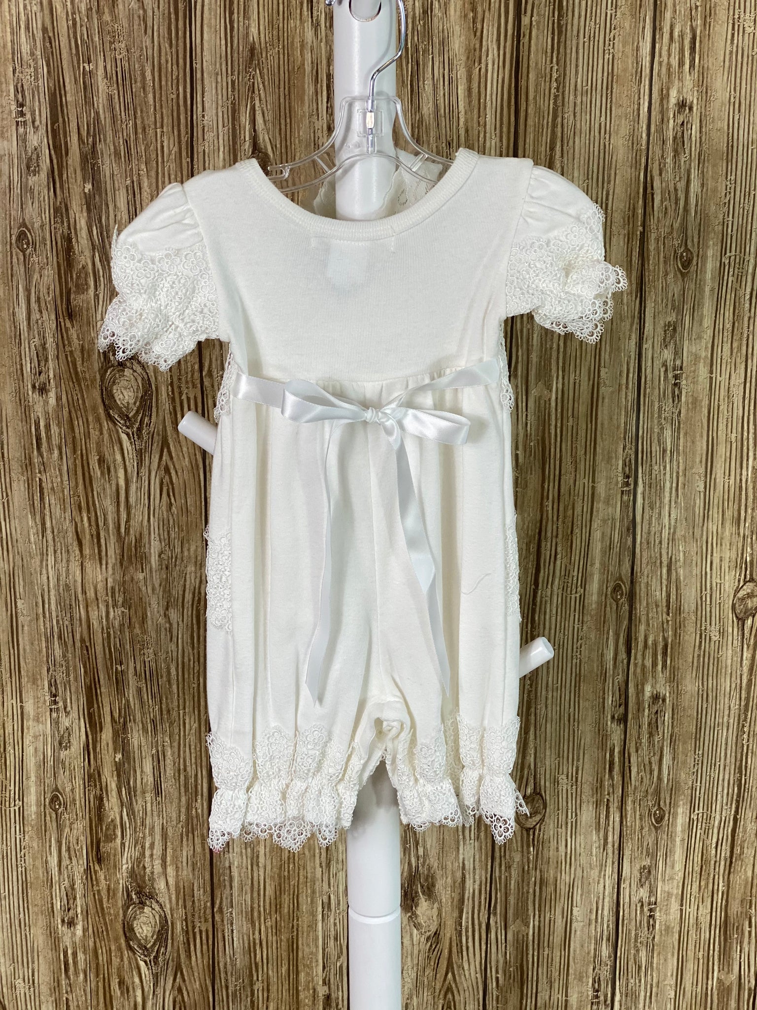 Ivory cotton romper Lace ruffles around bodice  Lace ruffles around legs Lace ruffles around arms Flowers on bodice lace ruffle Lace headband with flowers