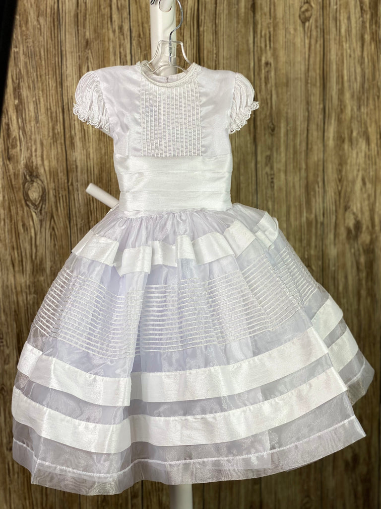 This a beautiful, one-of-a-kind baptism gown.  A lovely gown for a precious child.  White, size 12M Satin bodice with pinstripes Satin rushed cap sleeves Satin pleated belting Tulle and satin skirting with embroidered ribboning Satin bow in back Button closure