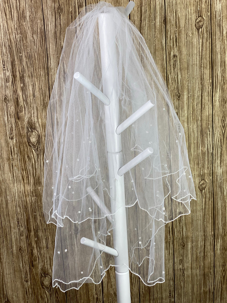 White - Floating Pearl Veil for First Communion   Elegant soft 2 layer veil with white pencil trim and delicate floating pearls.   Veil length - 30 in. long, comb - 7 cm wide  Materials:  sturdy plastic comb, soft tulle, and applique - pearls.