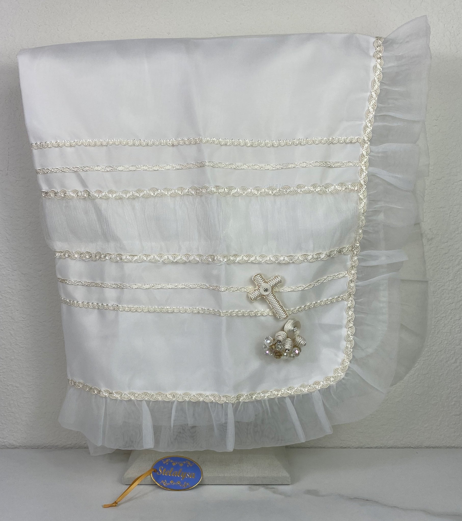 Beautiful ivory tulle silk baptism blanket with cross, ruffled edge, and jewels.