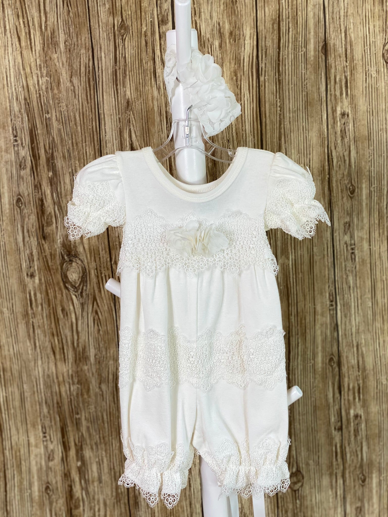 Ivory cotton romper Lace ruffles around bodice  Lace ruffles around legs Lace ruffles around arms Flowers on bodice lace ruffle Lace headband with flowers