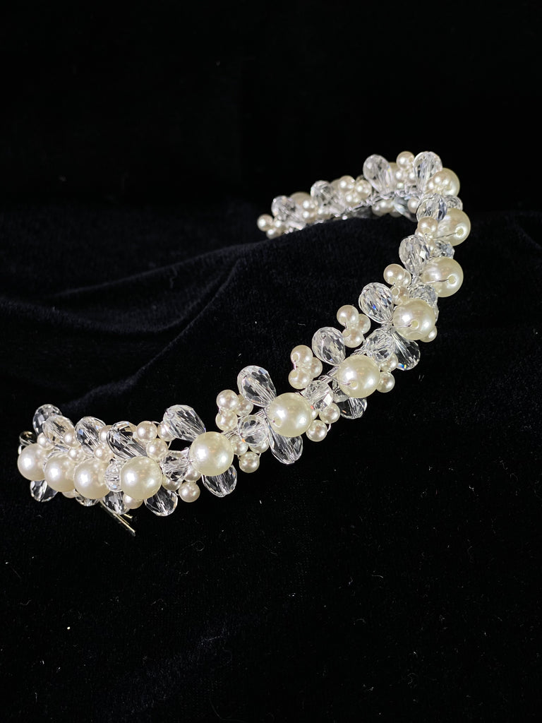 A must have for the First Communion!   Beautiful headband applique with pearl and crystal detailing.  Headband is 12" long, to sit beautifully around the head.  This headband will adorn a Stelalysa veil!  Wear with either a white or ivory First Communion dress!